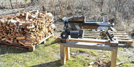 pile of woods and log splitter on top of a table
