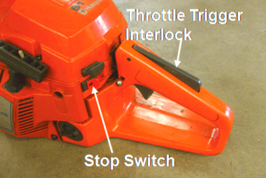 chainsaw stop switch and throttle interlock
