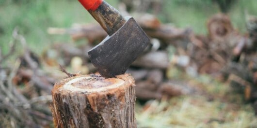 splitting wood using axe