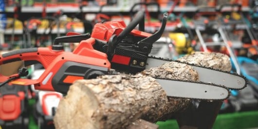 chainsaws attached on log