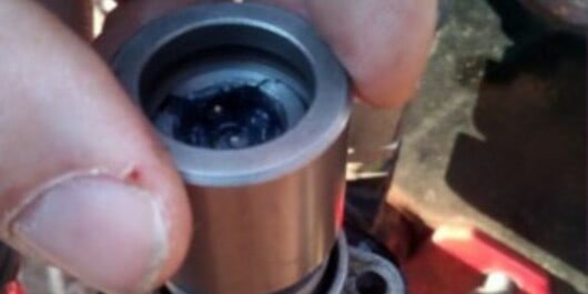 How To Fix Log Splitter When Auto Return Keeps Stopping 3 A person adjusting the auto-return pressure in log splitter