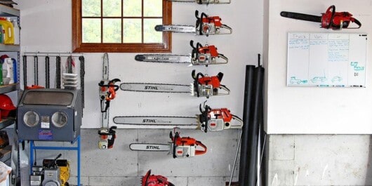 chainsaws hanging on the wall