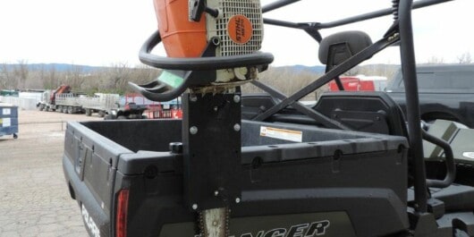 diy chainsaw holder attached to a car