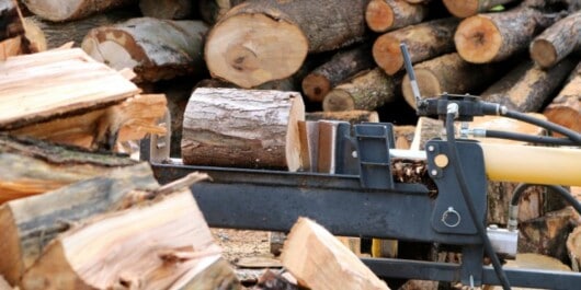 log splitter and a pile of firewoods