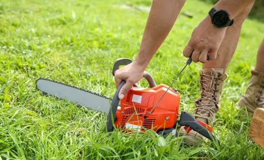 Is Using A Chainsaw Difficult: Possible Issues Beginners Might Face 6 man trying to start a chainsaw