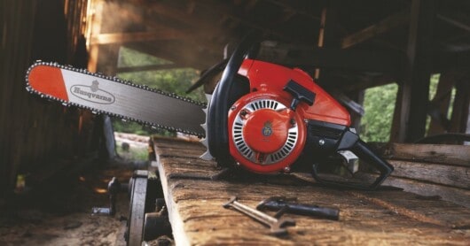 why were chainsaws made - chainsaw on a table